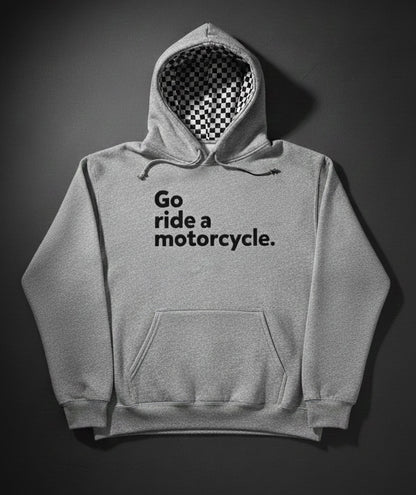 Gray hoodie with 'Go ride a motorcycle.' text and checkered flag lined hood on a dark background
