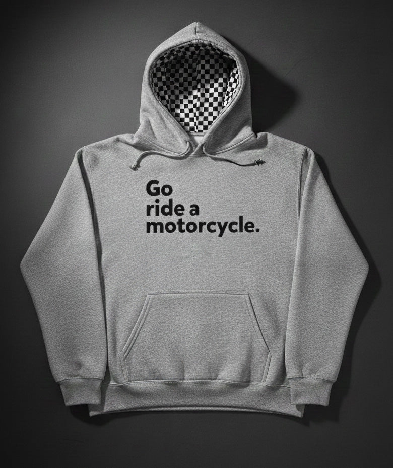 Gray hoodie with 'Go ride a motorcycle.' text and checkered flag lined hood on a dark background