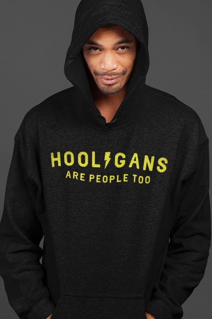 Man wearing hooded sweatshirt with "Hooligans are people too" text design on chest