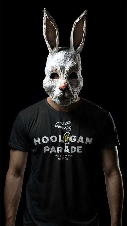 man in a bunny mask wearing a black t-shirt with original "hooligan parade" "send bail money" SF CA design on the chest