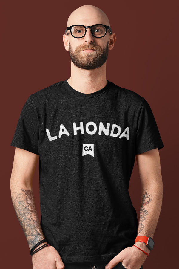 Man wearing a black heather t-shirt with La Honda California on chest in white