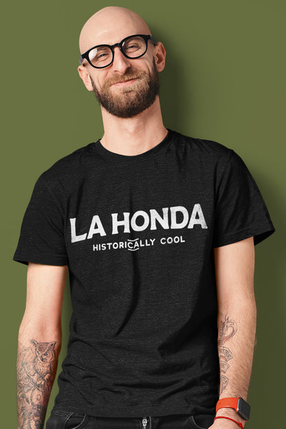 man wearing black heather short sleeve t-shirt with La Honda Historically Cool design on chest