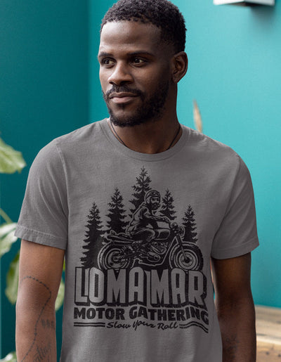 Man wearing grey short sleeve t-shirt with original Loma mar motor gathering scrambler motorcycle design on chest in black