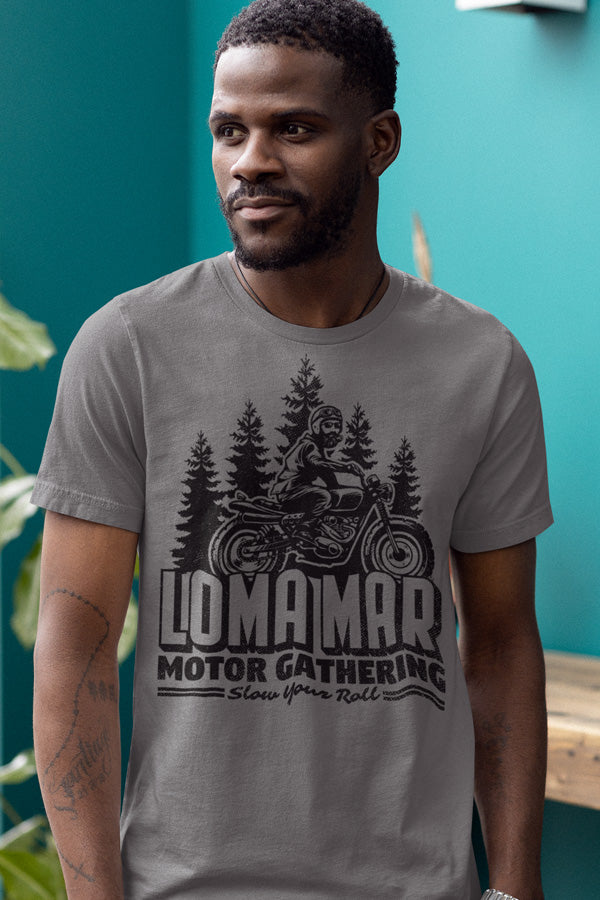 Man wearing grey short sleeve t-shirt with original Loma mar motor gathering scrambler motorcycle design on chest in black