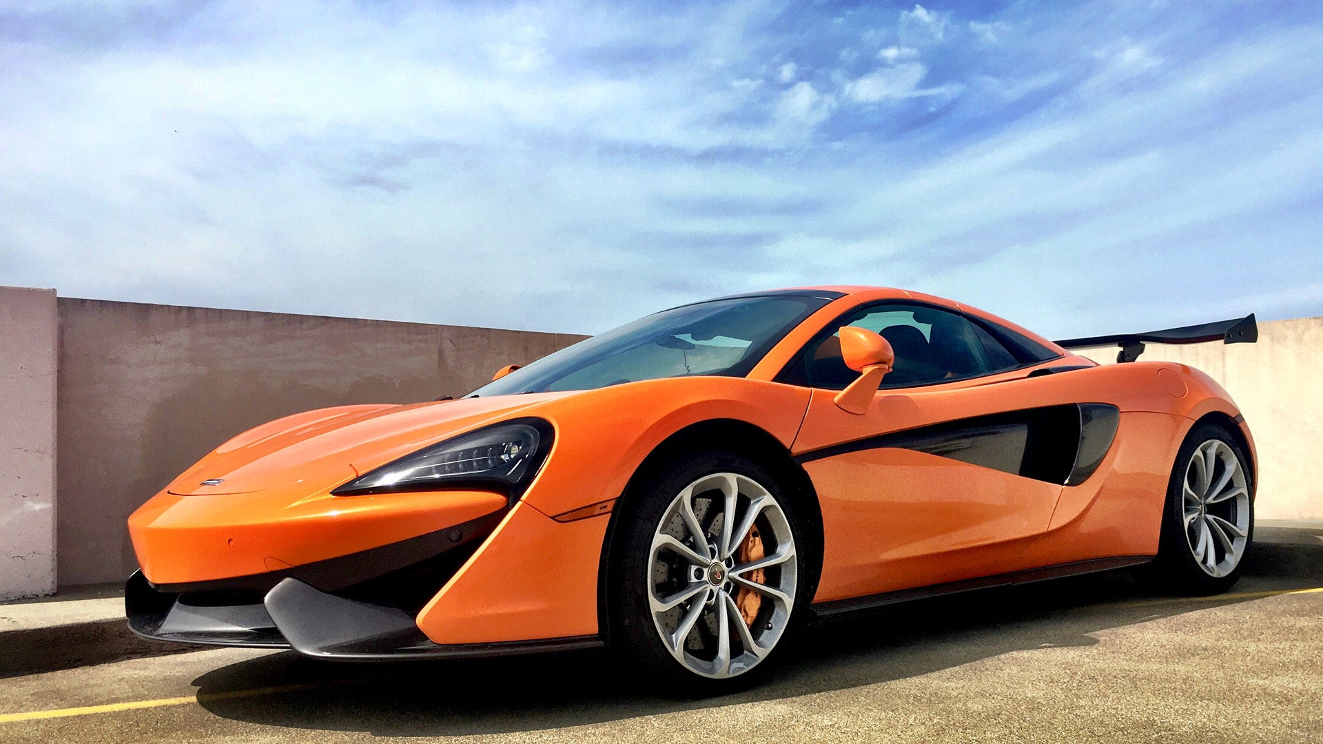 Image of an orange McLaren by Sky Londa Motor Club