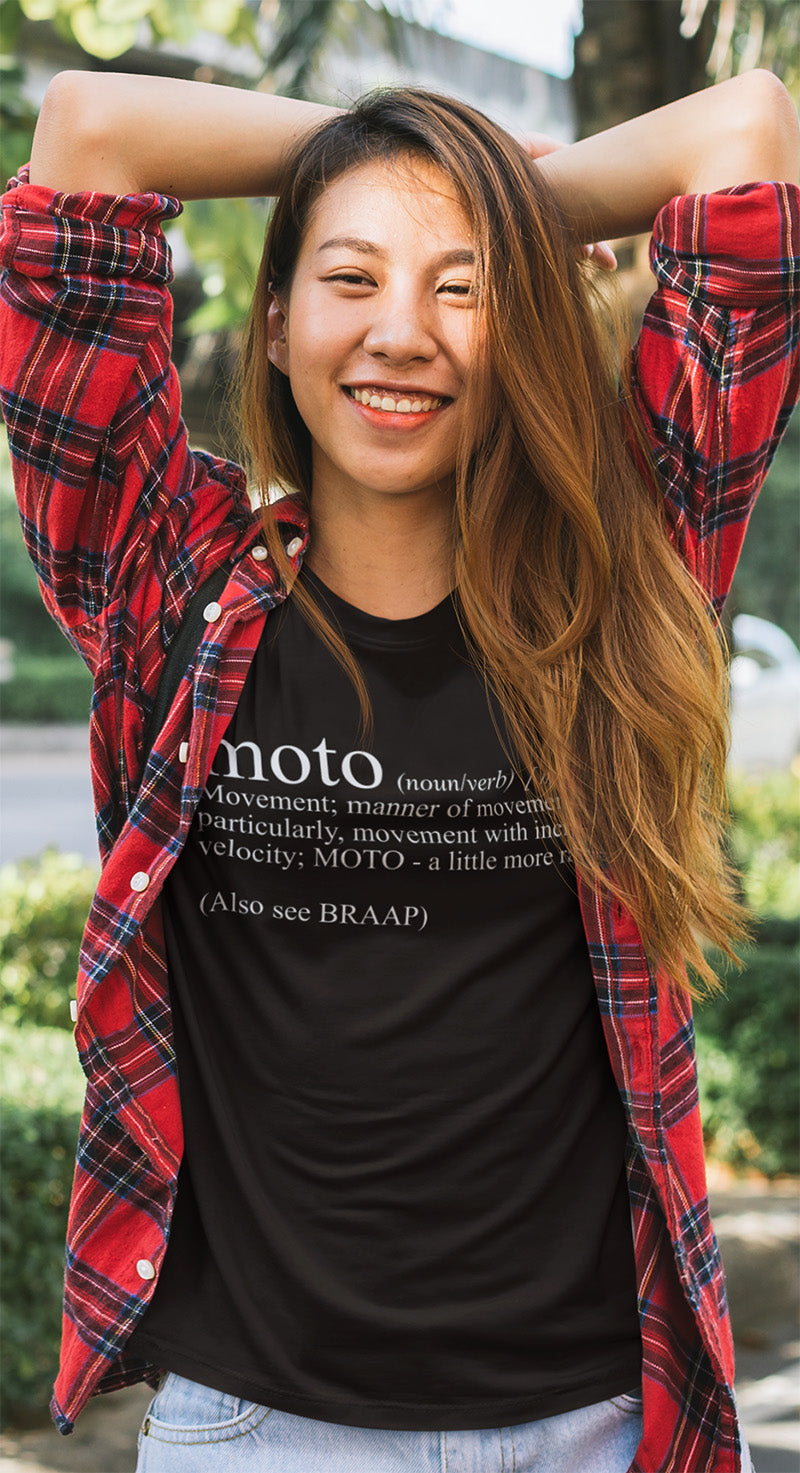 Young woman wearing a black t-shirt with Moto Definition design printed on chest