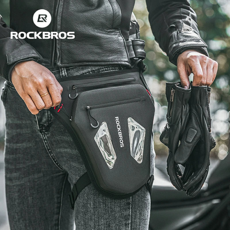 Person holding a black bag with 'RockBros' branding, wearing a black leather jacket.