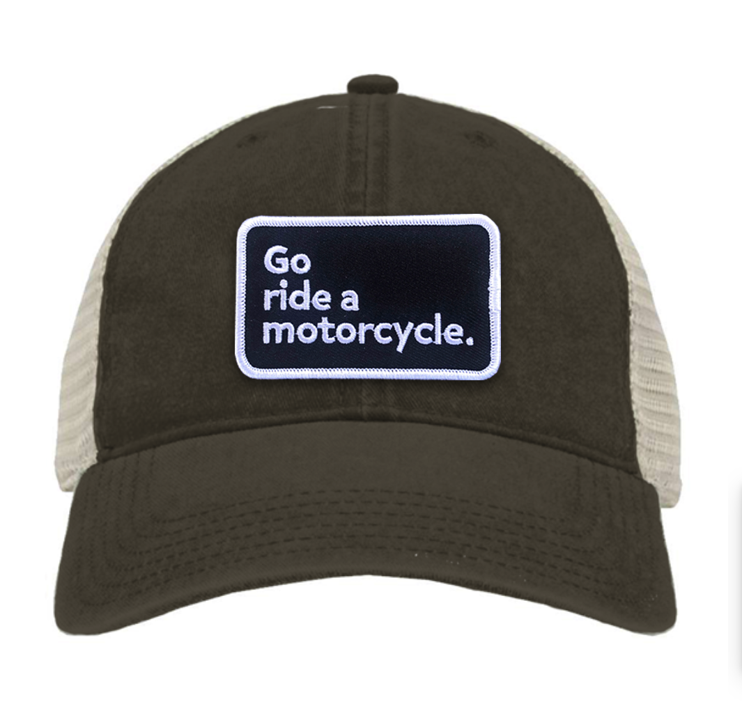 "Go ride a motorcycle" pigment dyed green trucker hat with patch sewn on front