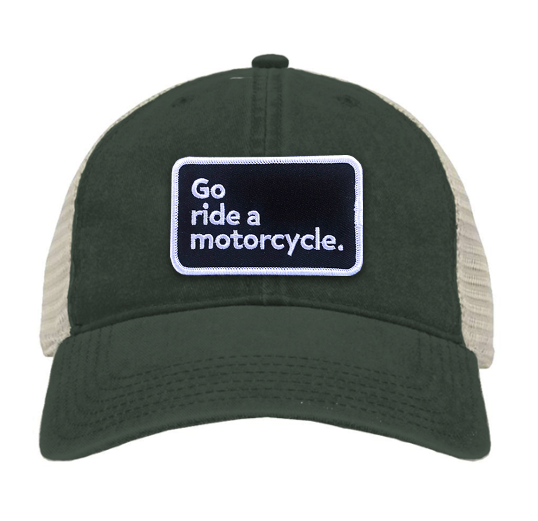 "Go ride a motorcycle" pigment dyed trucker hat with patch sewn on front