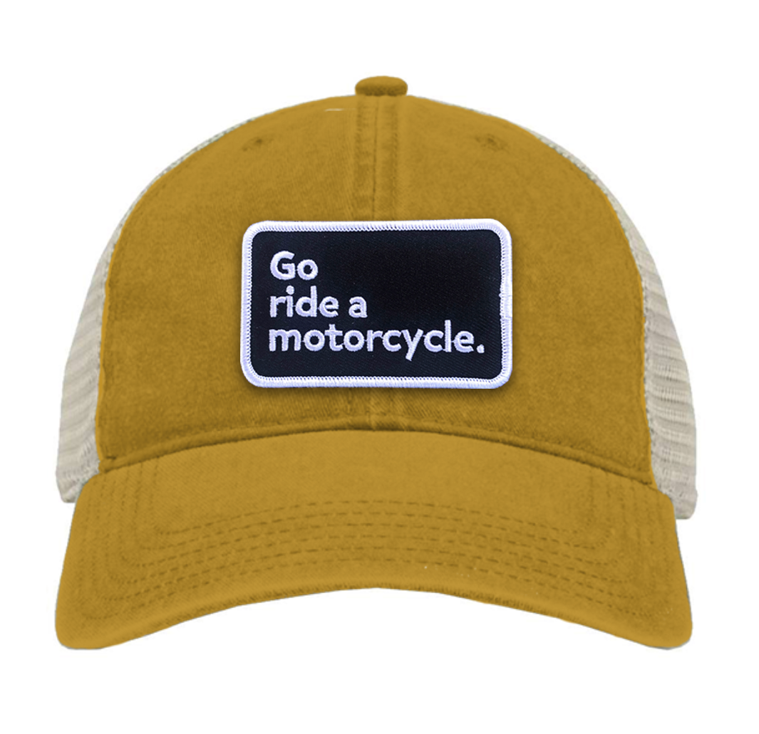 "Go ride a motorcycle" pigment dyed trucker hat with patch sewn on front