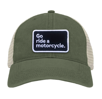 "Go ride a motorcycle" pigment dyed trucker hat with patch sewn on front