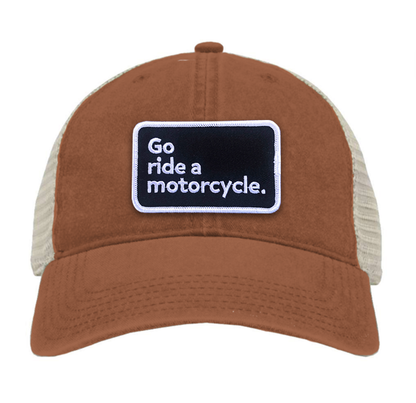 "Go ride a motorcycle" pigment dyed trucker hat with patch sewn on front