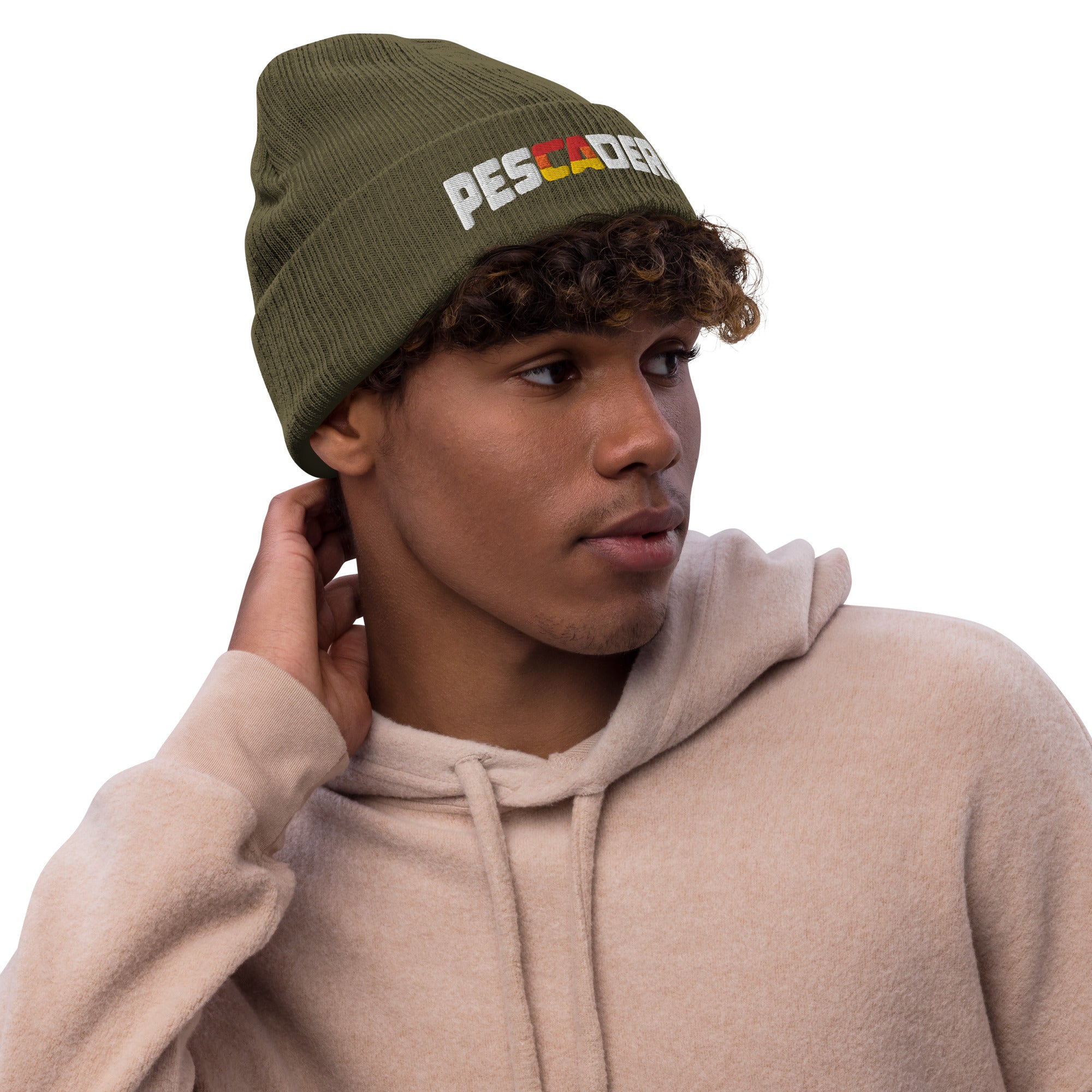 Young man wearing Pescadero Sunset embroidered ribbed knit beanie