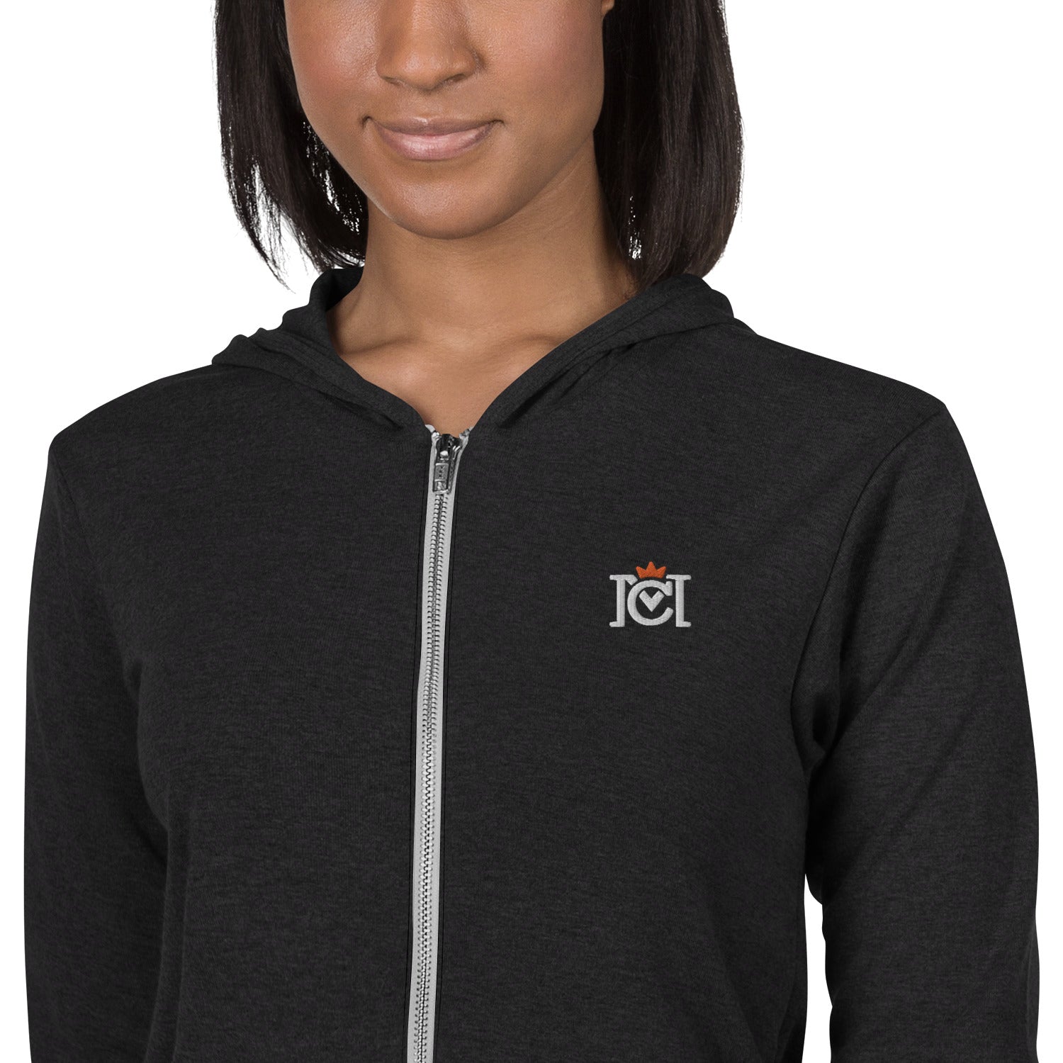 Woman wearing lightweight full zip hoodie with trademarked crown moto logo embroidered on left chest