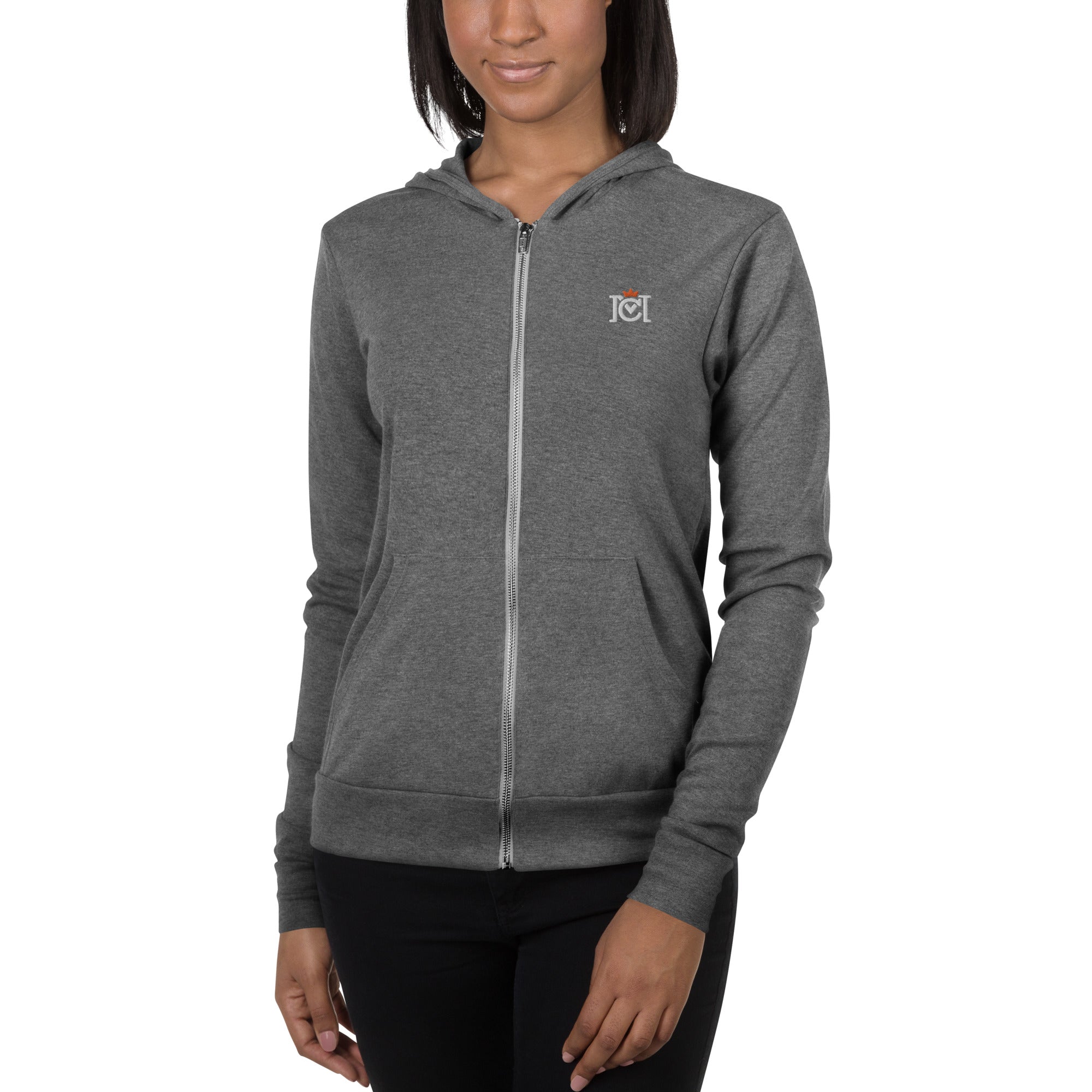 Woman wearing lightweight full zip hoodie with trademarked crown moto logo embroidered on left chest