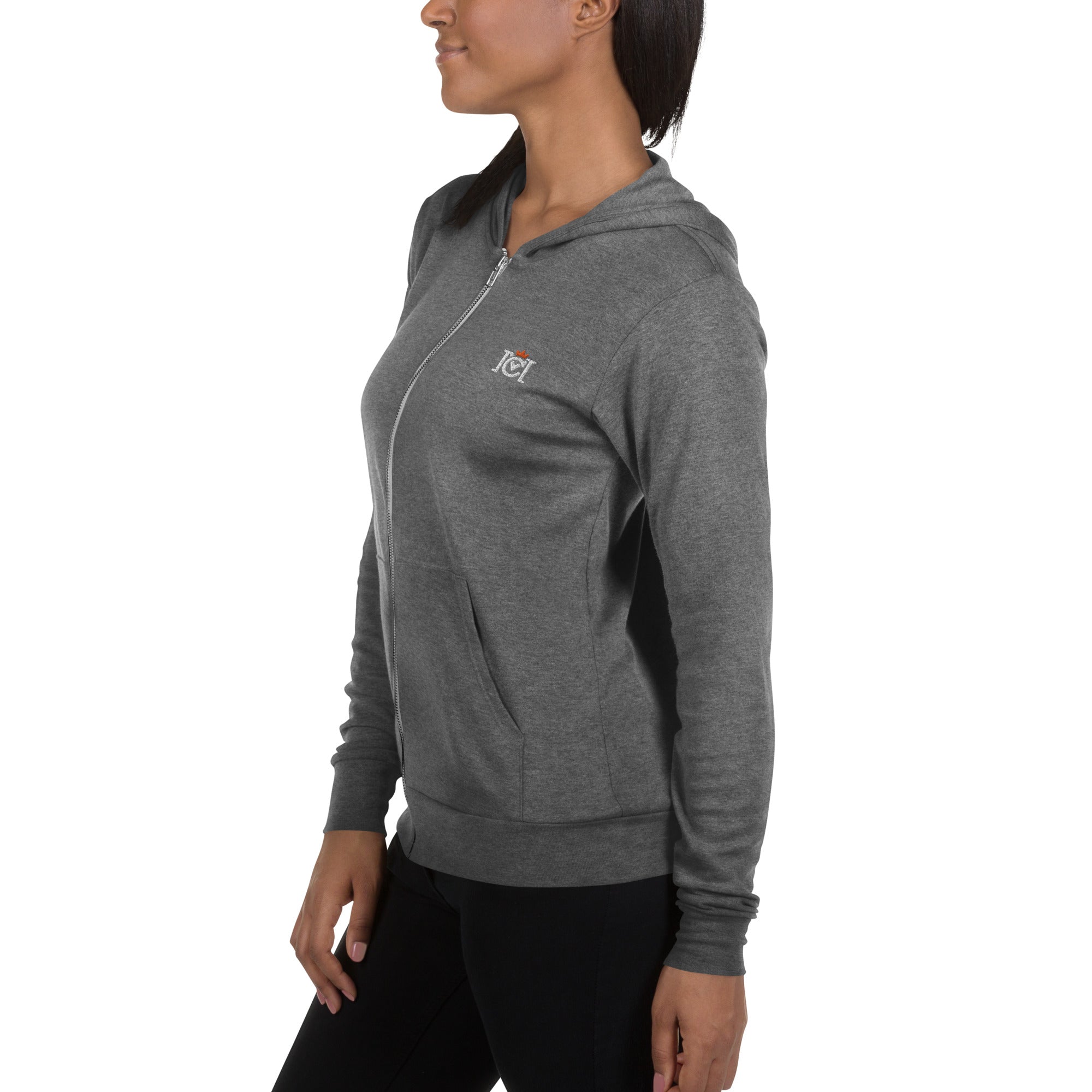 Woman wearing lightweight full zip hoodie with trademarked crown moto logo embroidered on left chest