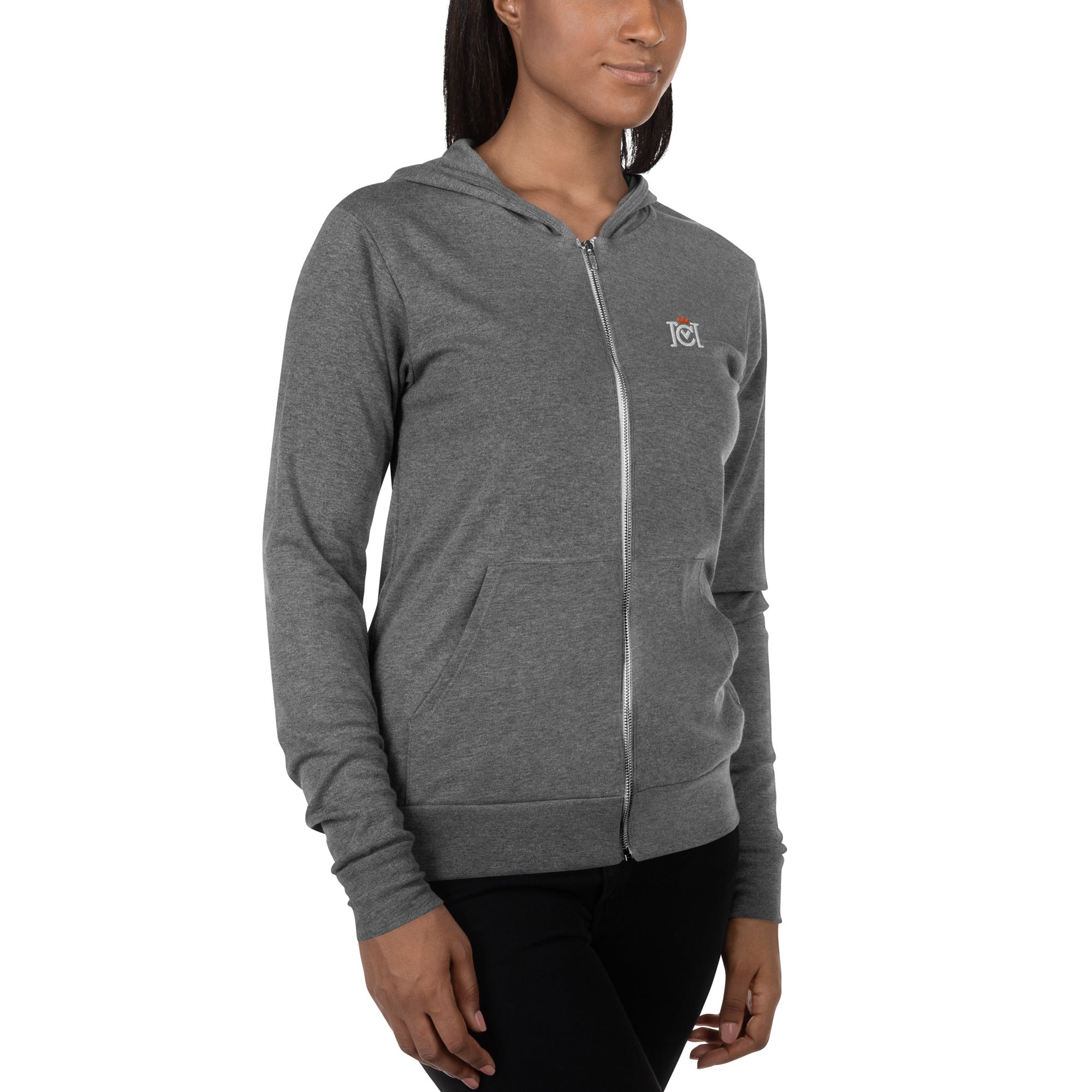 Woman wearing lightweight full zip hoodie with trademarked crown moto logo embroidered on left chest