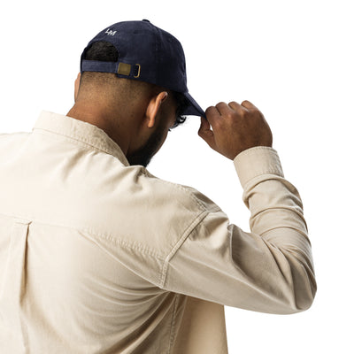 man wearing loma mar "slow your roll" vintage corduroy hat back with LM embroidered and buckle adjustment