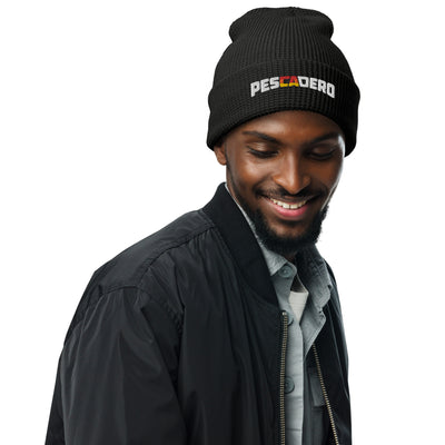 Man wearing Pescadero Sunset embroidered waffle knit beanie