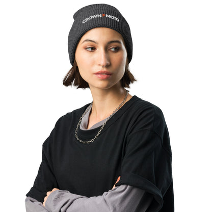 woman wearing "crown moto" text and lightning bolt embroidered on cuff of waffle knit beanie