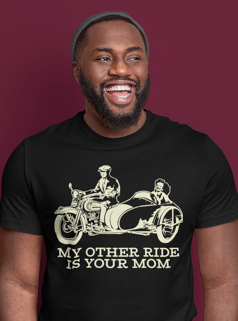 Man wearing a black t-shirt with a funny graphic and text