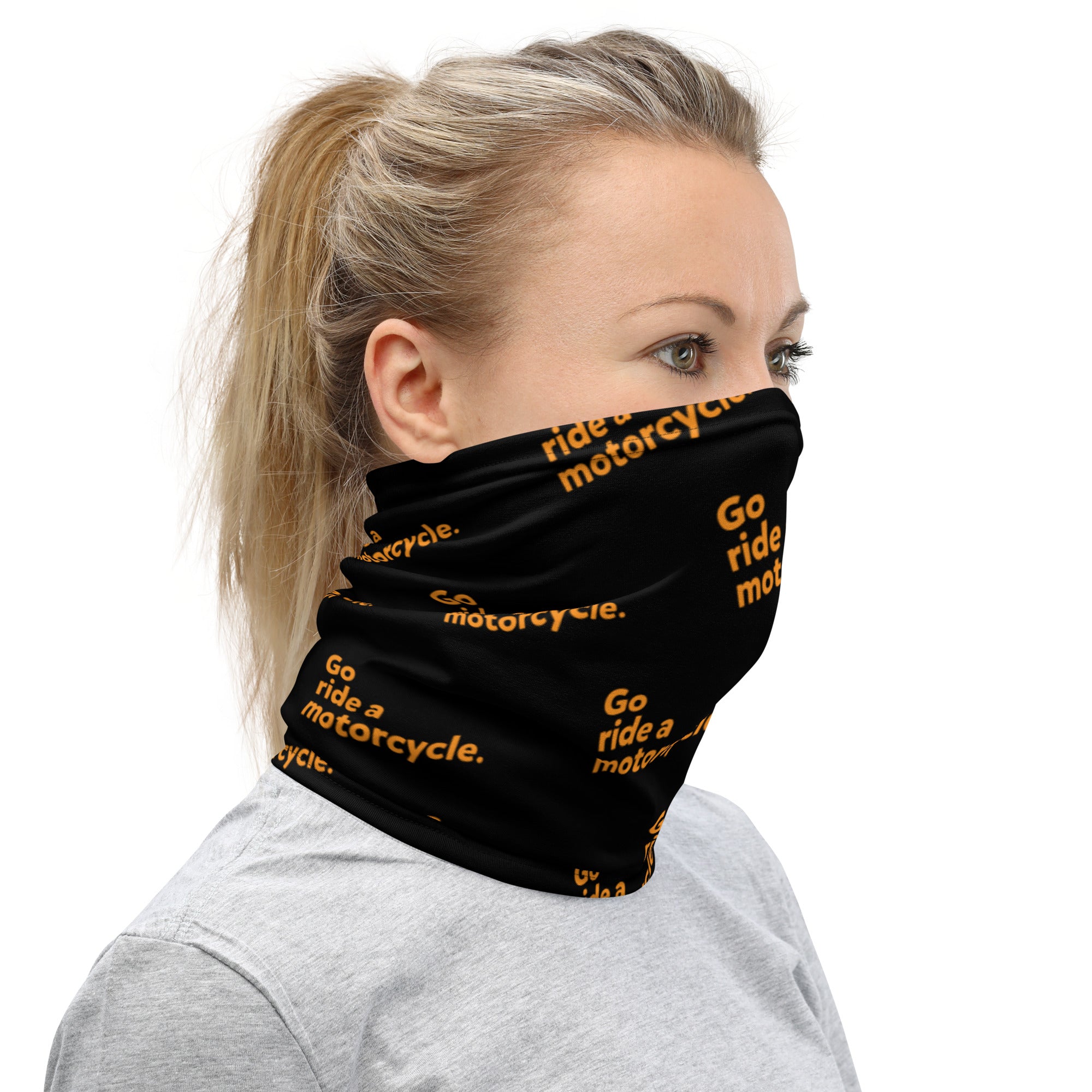 Orange "Go ride a motorcycle"  repeated at an angle on premium neck gaiter sleeve