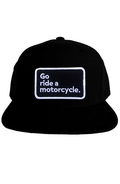 "Go ride a motorcycle" patch sewn on front of snapback hat