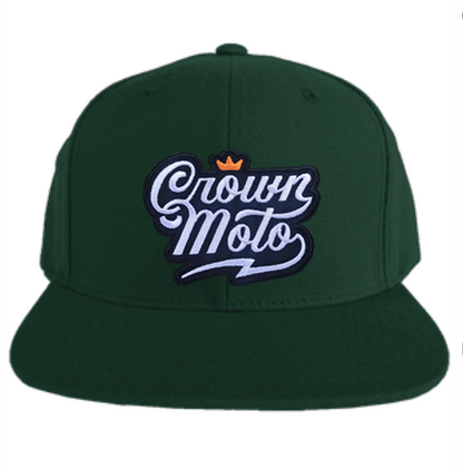 crown moto script logo patch sewn to the front of spruce green flat brim snapback hat