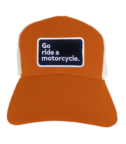 "Go ride a motorcycle" patch sewn to the front of eco trucker hat