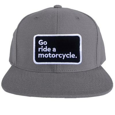 "Go ride a motorcycle" patch sewn on front of snapback hat