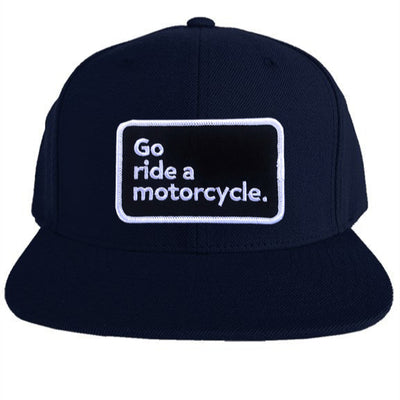 "Go ride a motorcycle" patch sewn on front of snapback hat