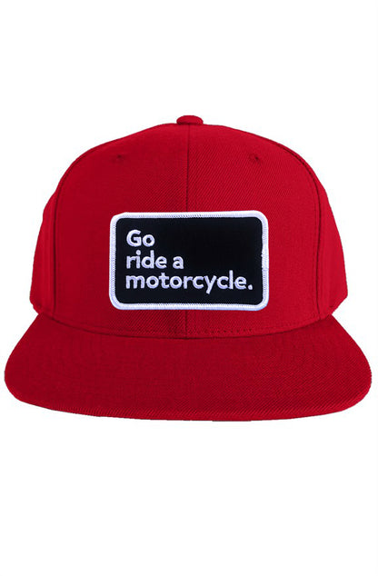 "Go ride a motorcycle" patch sewn on front of snapback hat